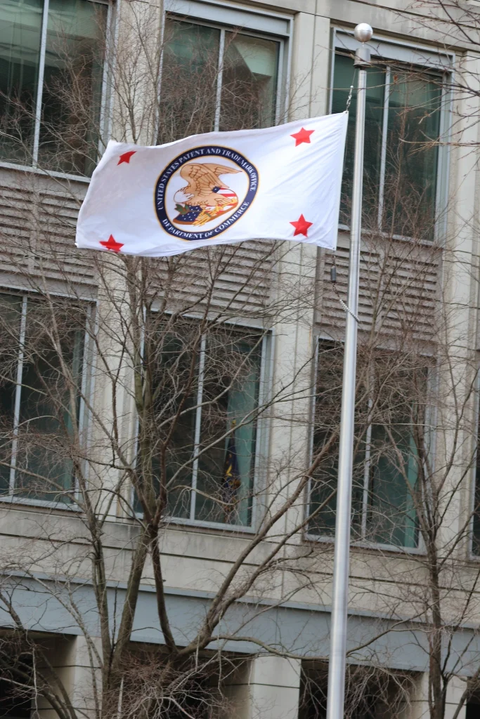 Flag of the United States Patent and Trademark Office (USPTO) outside headquarters in Alexandria, VA